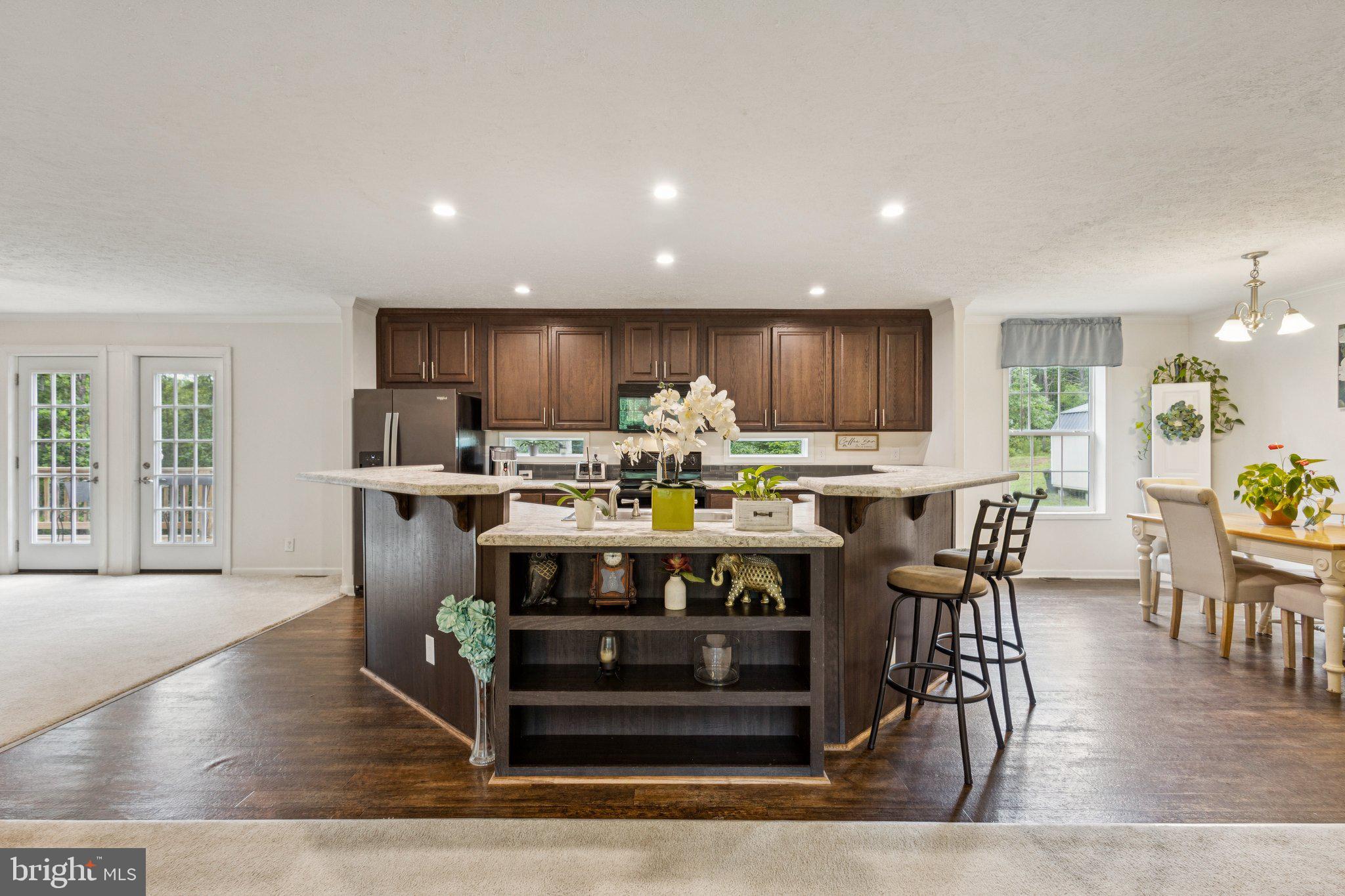 13153 Stonehouse Mountain Road Culpeper, VA 22701 - Photo 8 of 45 a kitchen with a table and chairs in it