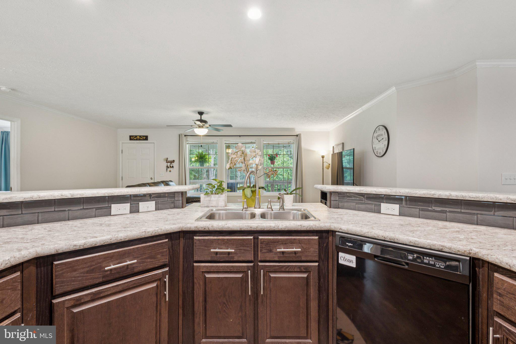 13153 Stonehouse Mountain Road Culpeper, VA 22701 - Photo 9 of 45 a kitchen with a sink stove and cabinets