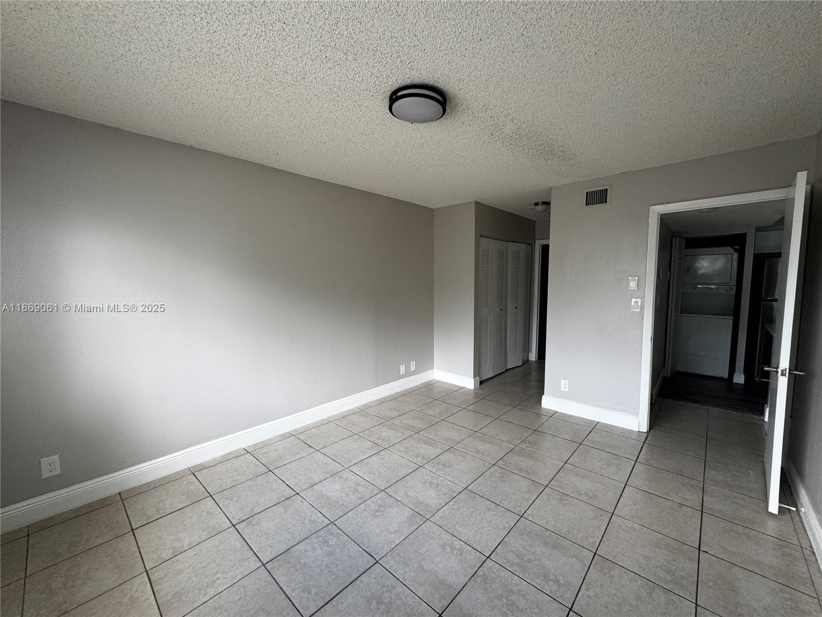5780 Rock Island Road, Unit 375 Tamarac, FL 33319 - Photo 14 of 26 a view of an empty room and window