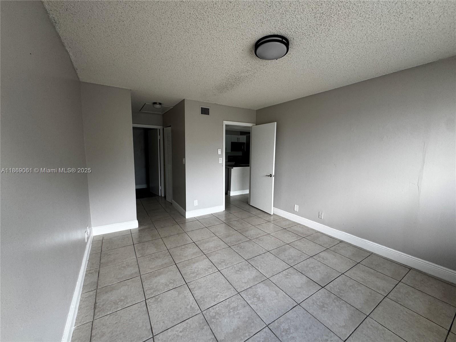 5780 Rock Island Road, Unit 375 Tamarac, FL 33319 - Photo 15 of 26 a view of an empty room and window
