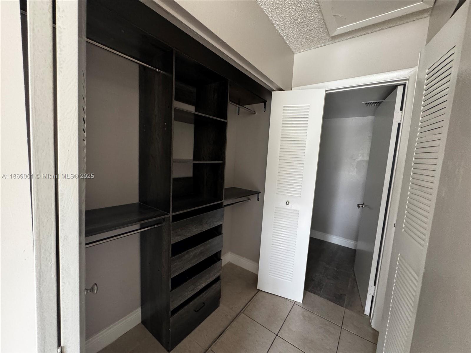 5780 Rock Island Road, Unit 375 Tamarac, FL 33319 - Photo 16 of 26 a view of walk in closet