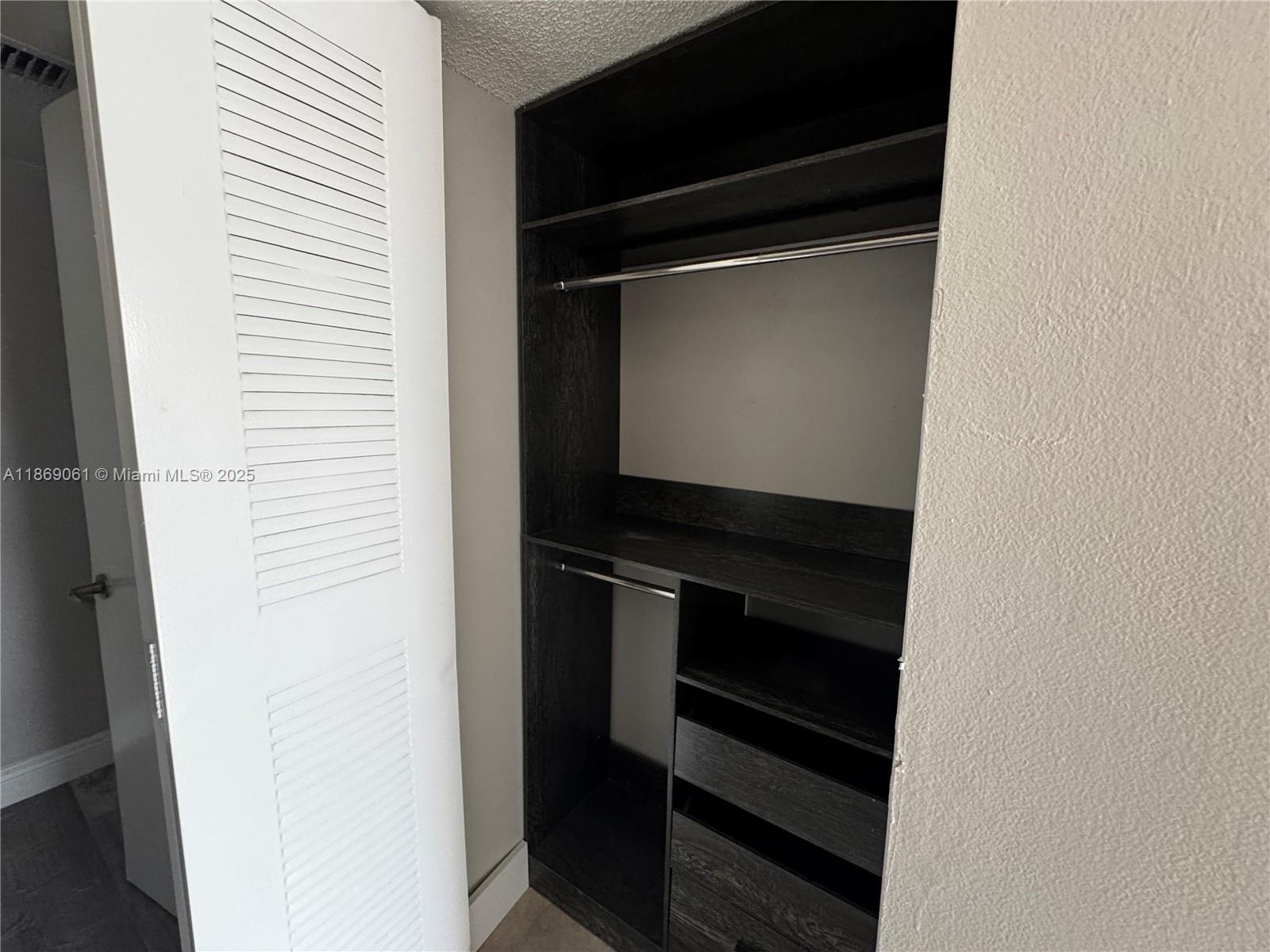 5780 Rock Island Road, Unit 375 Tamarac, FL 33319 - Photo 17 of 26 a close view of walk in closet