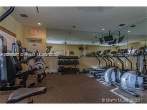 5780 Rock Island Road, Unit 375 Tamarac, FL 33319 - Photo 25 of 26 a view of a room with gym equipment