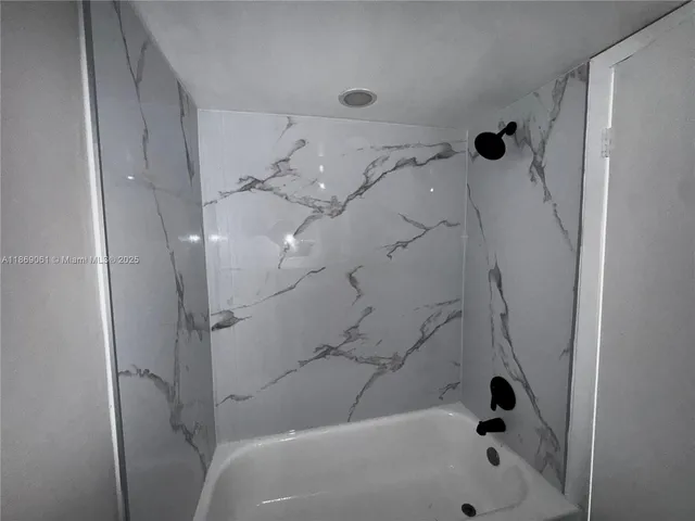 a bathroom with a bathtub