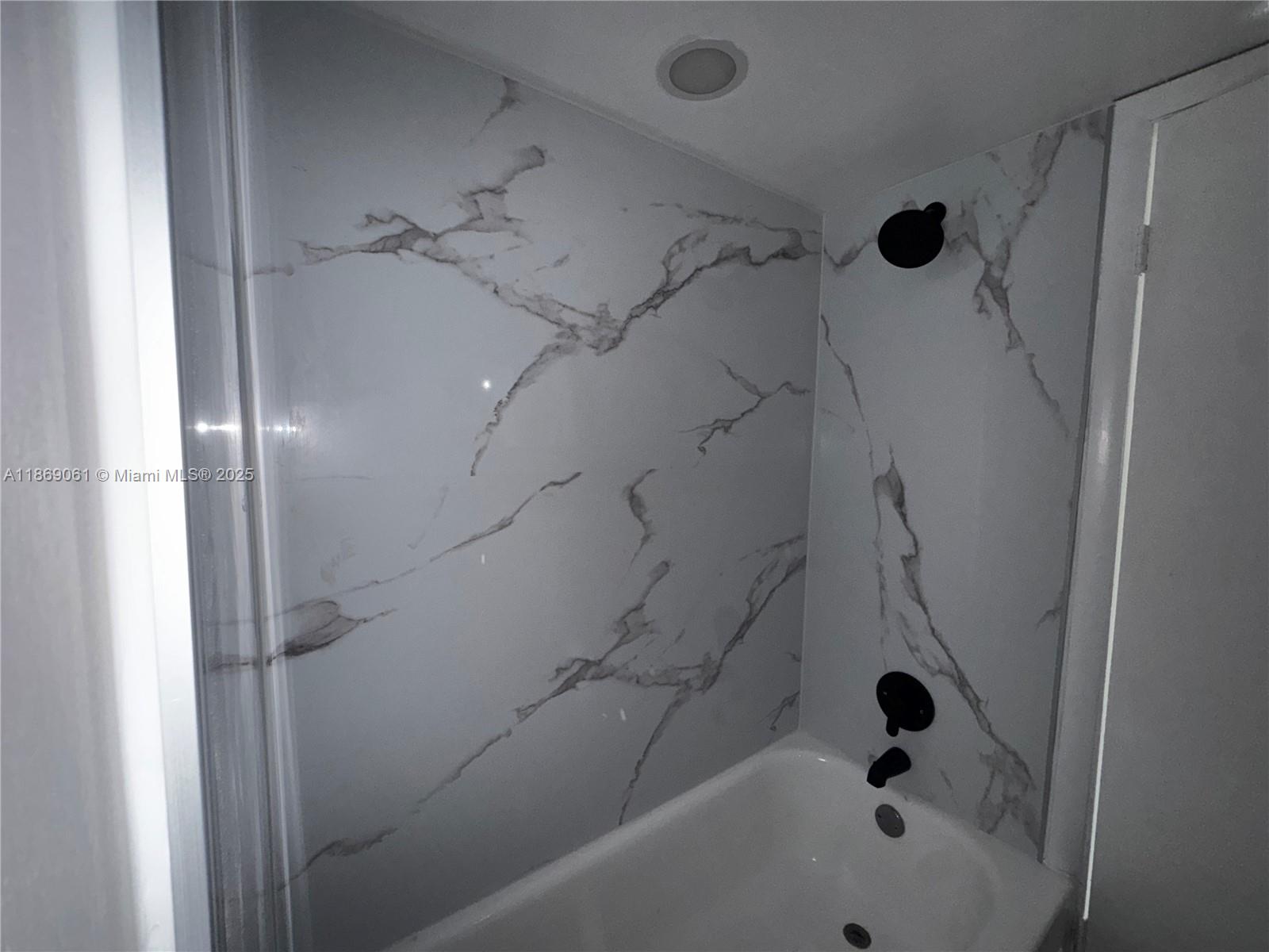 5780 Rock Island Road, Unit 375 Tamarac, FL 33319 - Photo 5 of 26 a bathroom with a bathtub