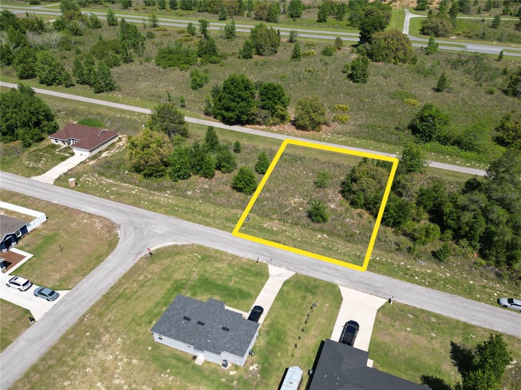 57 Southwest 57th Terrace Road, Unit LOT 9 Ocala, FL 34473 - Photo 1 of 1 an aerial view of a house with pool yard swimming pool and outdoor seating