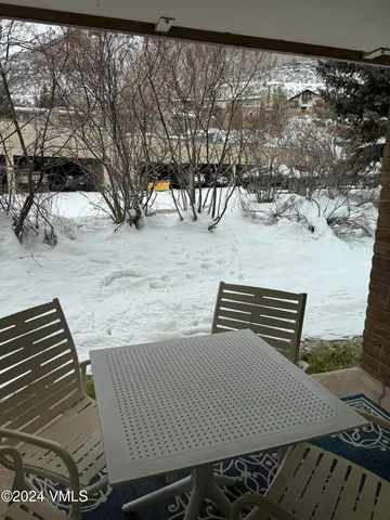 a view of a backyard with a bench