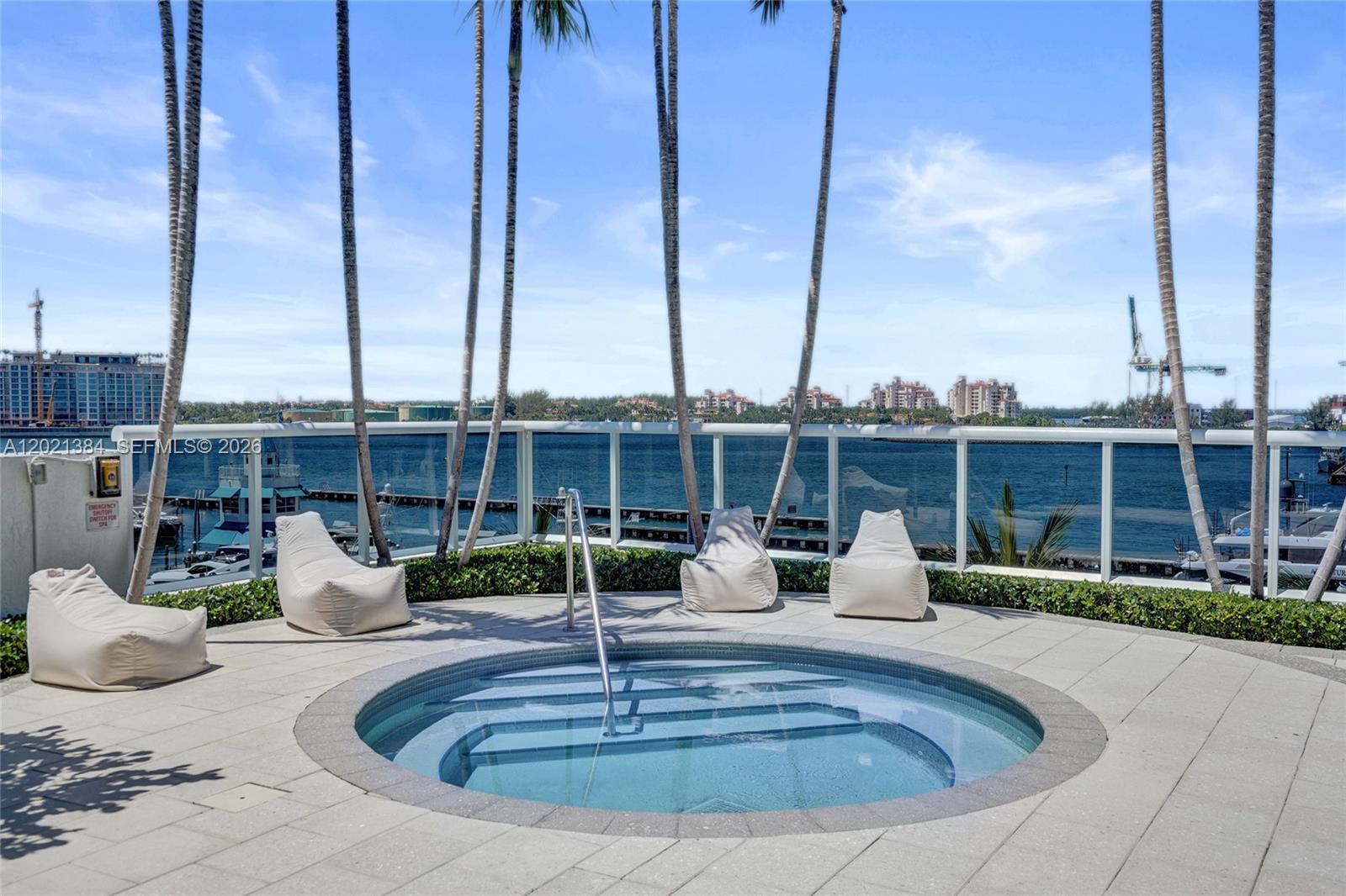 400 Alton Road, Unit PH11 Miami Beach, FL 33139 - Photo 41 of 49 a view of a swimming pool with a patio