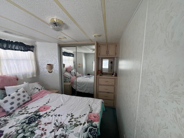 2795 East 28th Road Marseilles, IL 61341 - Photo 16 of 64 a bedroom with a bed and a mirror