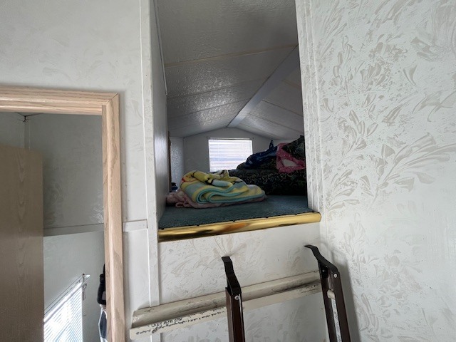 2795 East 28th Road Marseilles, IL 61341 - Photo 19 of 64 a view of hallway with a chair and frames on wall