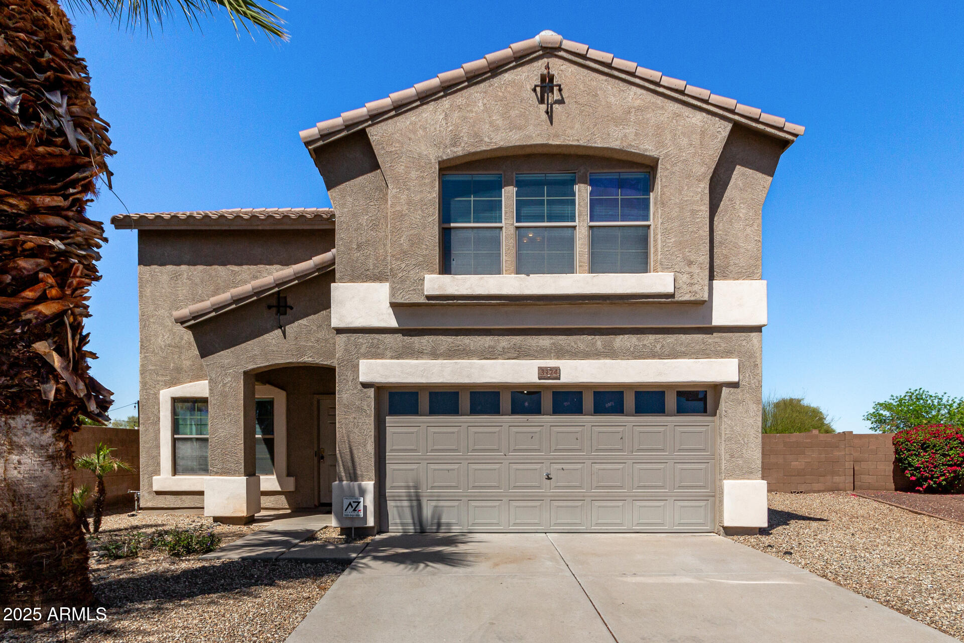 a front view of a house with a garage
