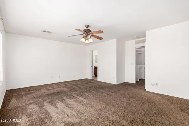 a view of a big room with carpet