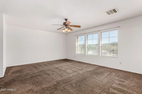 a bathroom with a double vanity sink toilet and a mirror