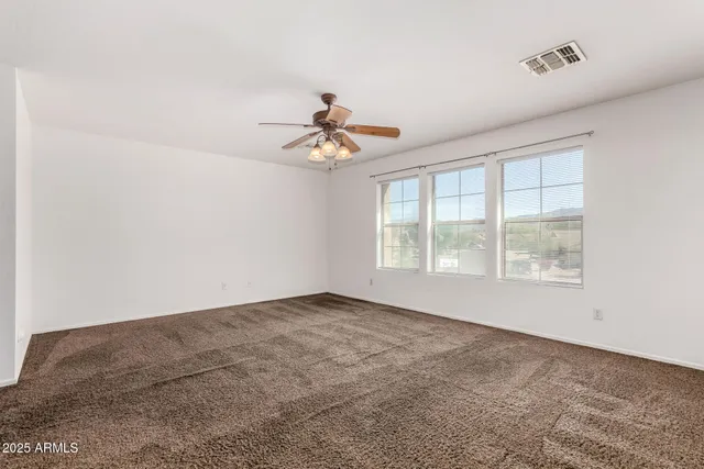 a bathroom with a double vanity sink toilet and a mirror