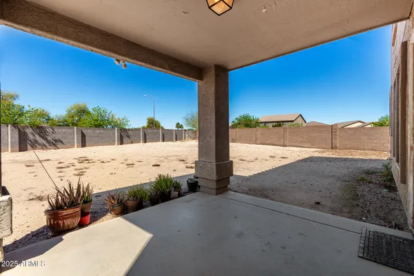 a view of a backyard of the house