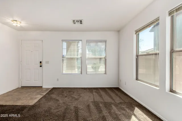 an empty room with windows