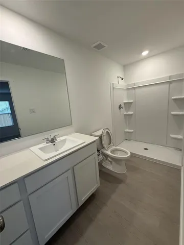 a view of an empty room and a window