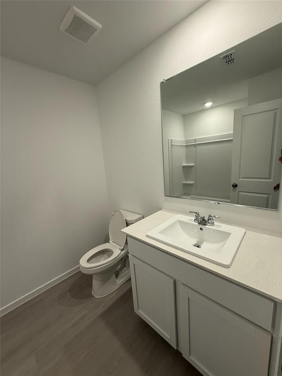 835 Ginkgo Way Princeton, TX 75407 - Photo 8 of 10 a bathroom with a toilet sink and mirror