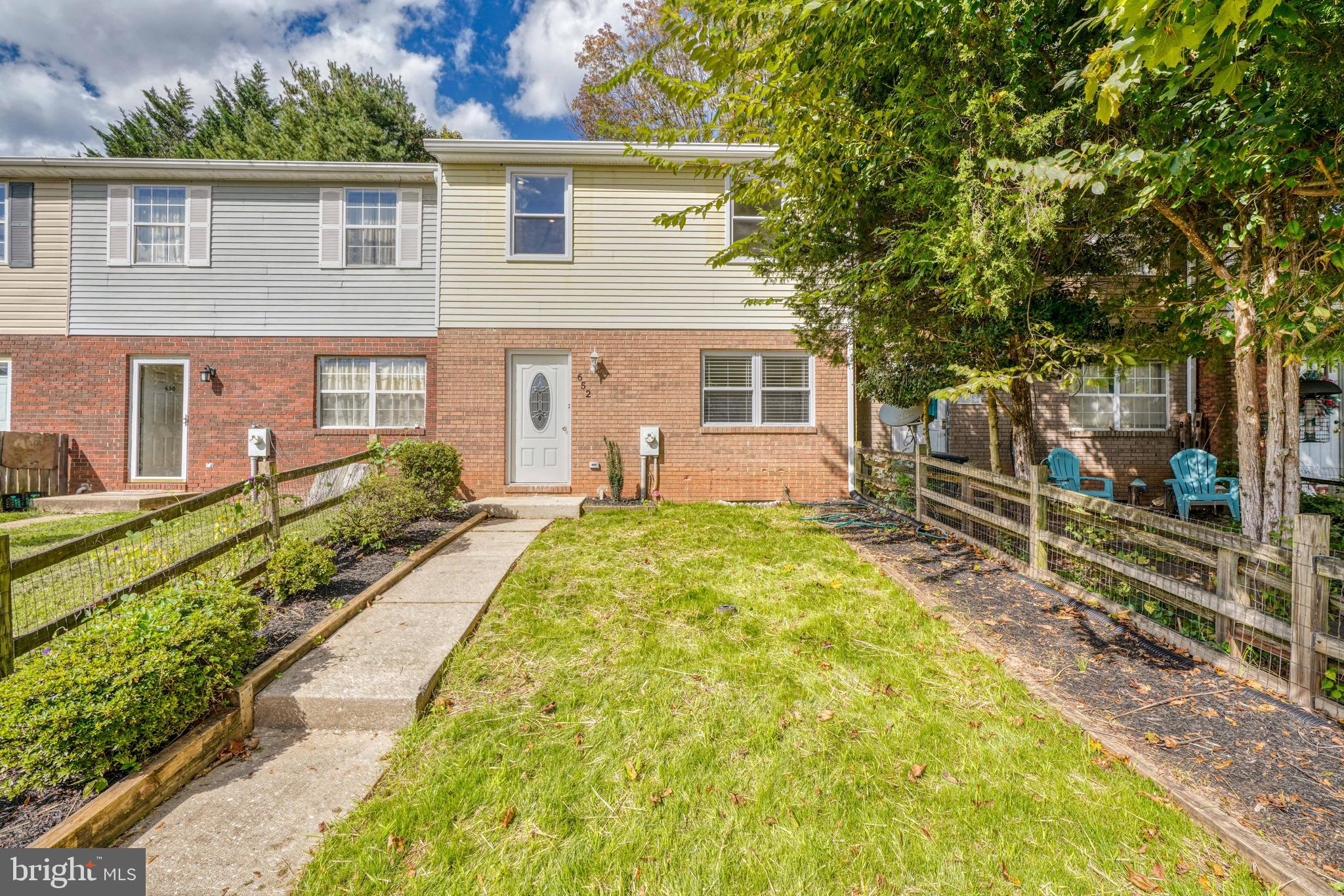 652 Glynock Place Reisterstown, MD 21136 - Photo 1 of 28 a front view of house with yard