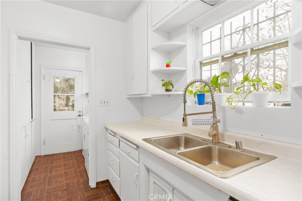1615 North Van Ness Avenue Compton, CA 90221 - Photo 19 of 36 a kitchen that has a sink and a window