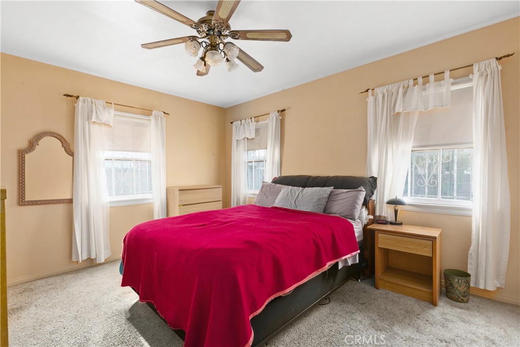 1615 North Van Ness Avenue Compton, CA 90221 - Photo 24 of 36 a bedroom with a bed and a window