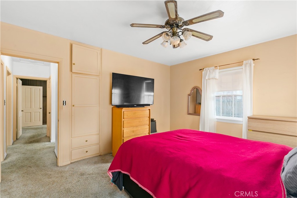 1615 North Van Ness Avenue Compton, CA 90221 - Photo 25 of 36 a bed room with a bed and a flat screen tv