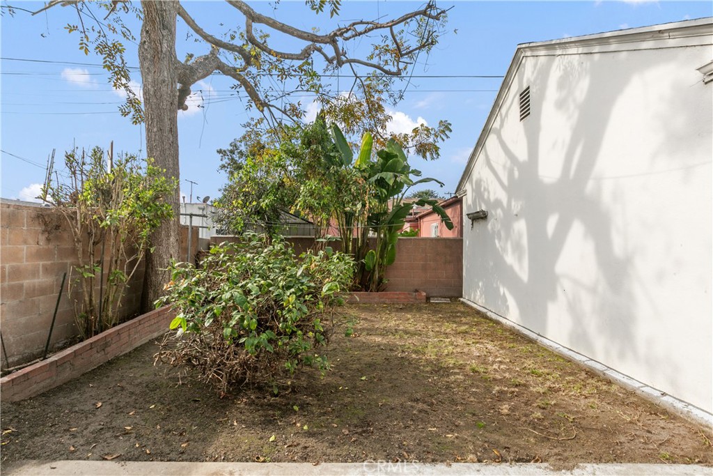 1615 North Van Ness Avenue Compton, CA 90221 - Photo 31 of 36 a view of a house with a yard