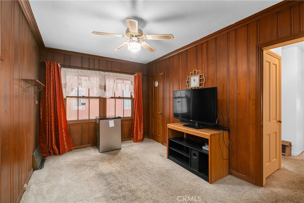 1615 North Van Ness Avenue Compton, CA 90221 - Photo 10 of 36 a living room with furniture and flat screen tv