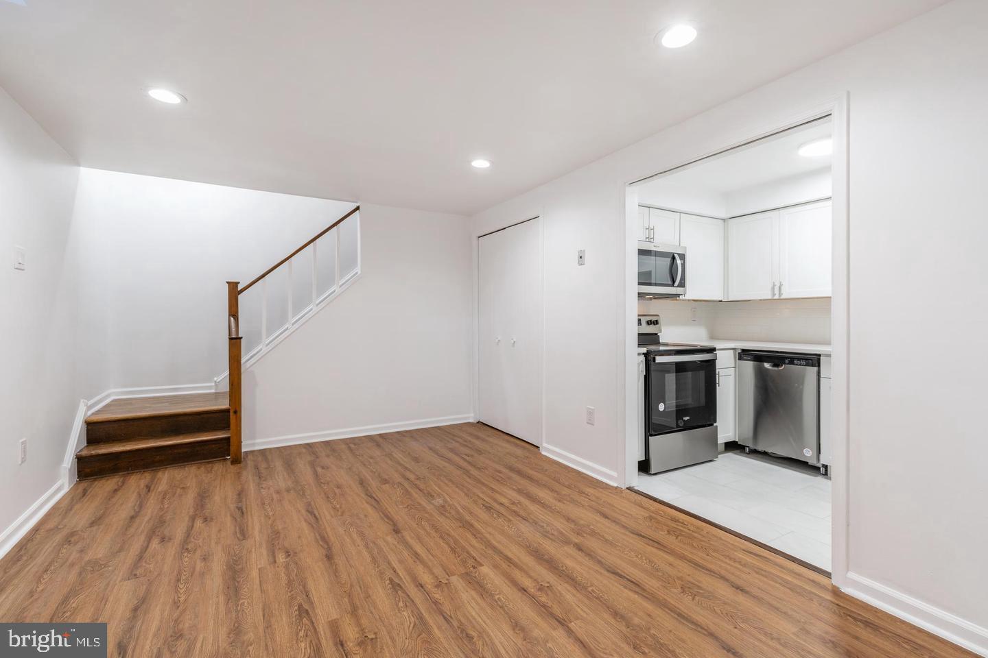 422 South 15th Street, Unit 1 Philadelphia, PA 19146 - Photo 11 of 19 a view of kitchen with wooden floor electronic appliances and stairs