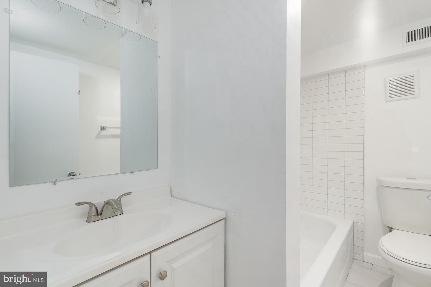 422 South 15th Street, Unit 1 Philadelphia, PA 19146 - Photo 18 of 19 a bathroom with a sink a toilet and shower
