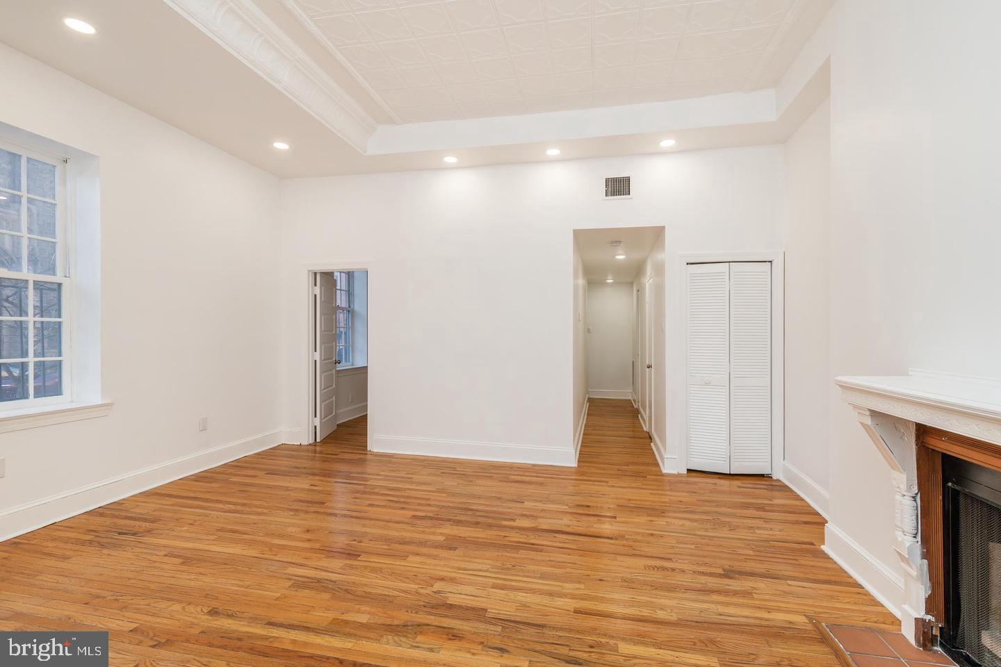 422 South 15th Street, Unit 1 Philadelphia, PA 19146 - Photo 7 of 19 a view of an empty room with wooden floor and a bathroom