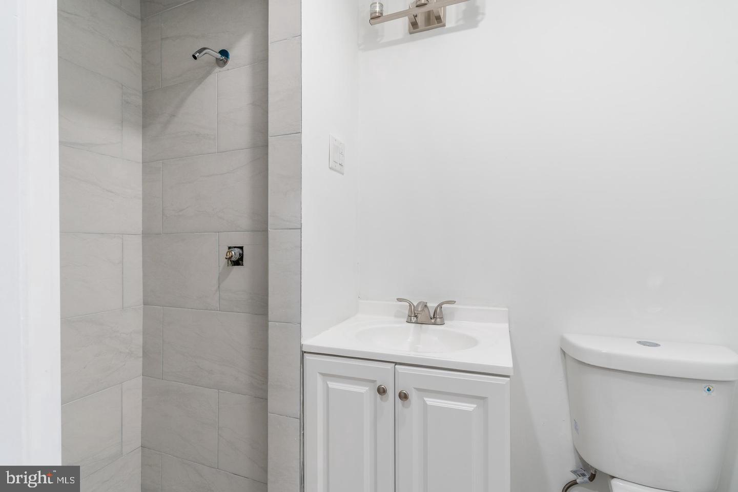 422 South 15th Street, Unit 1 Philadelphia, PA 19146 - Photo 10 of 19 a bathroom with a sink a toilet and shower