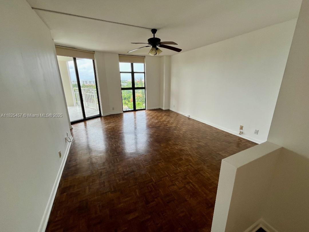 1000 Quayside Terrace, Unit 1009 Miami, FL 33138 - Photo 13 of 50 wooden floor in an empty room with a window