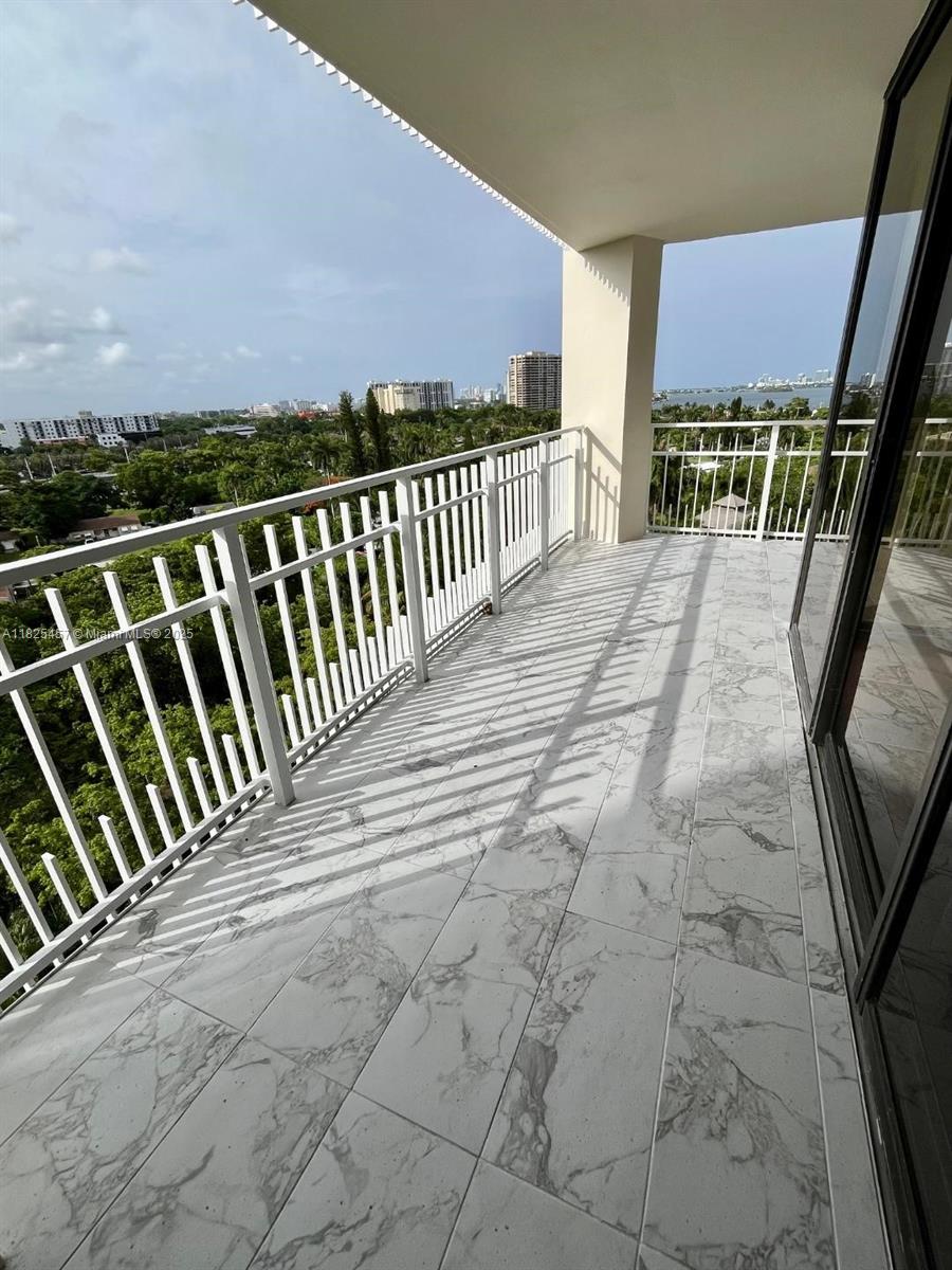 1000 Quayside Terrace, Unit 1009 Miami, FL 33138 - Photo 18 of 50 a view of balcony with wooden floor and city view