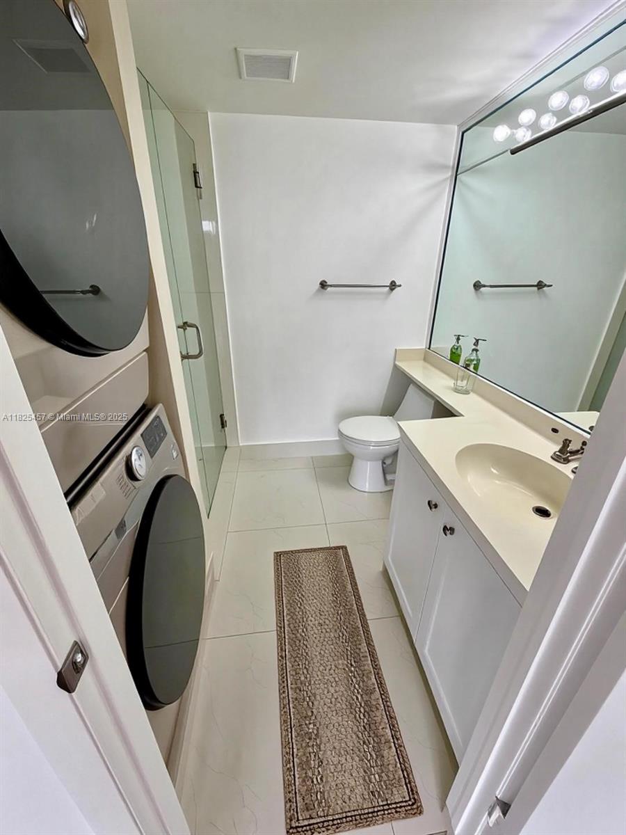 1000 Quayside Terrace, Unit 1009 Miami, FL 33138 - Photo 20 of 50 a bathroom with a sink a toilet and shower