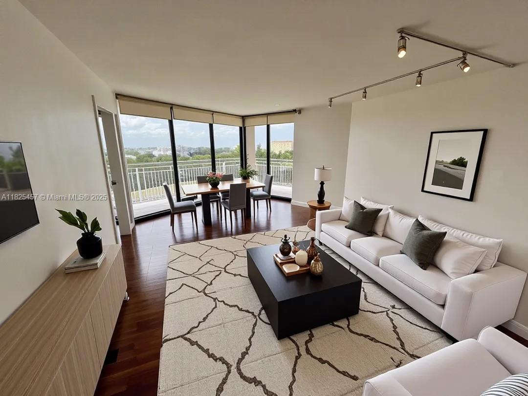 1000 Quayside Terrace, Unit 1009 Miami, FL 33138 - Photo 2 of 50 a living room with furniture and a large window