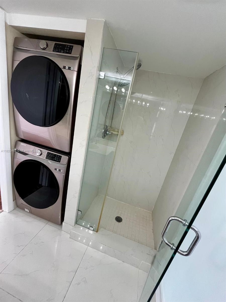 1000 Quayside Terrace, Unit 1009 Miami, FL 33138 - Photo 21 of 50 a bathroom with a sink and washing machine