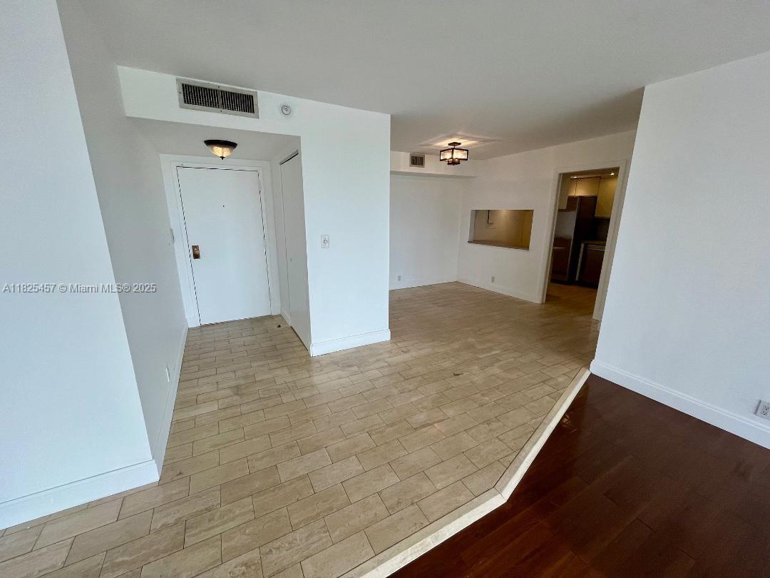 1000 Quayside Terrace, Unit 1009 Miami, FL 33138 - Photo 6 of 50 wooden floor in an empty room