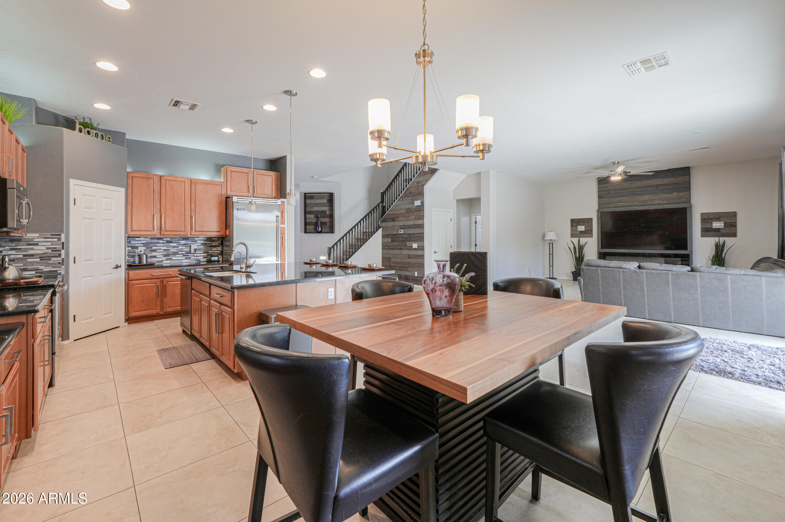 45247 West Jack Rabbit Trail Maricopa, AZ 85139 - Photo 22 of 75 a large kitchen with a table and chairs