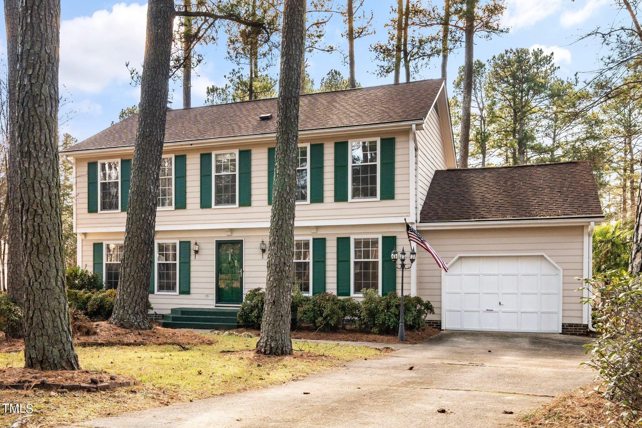 5705 Timber Ridge Drive Raleigh, NC 27609 - Photo 25 of 31 a front view of a house with a yard