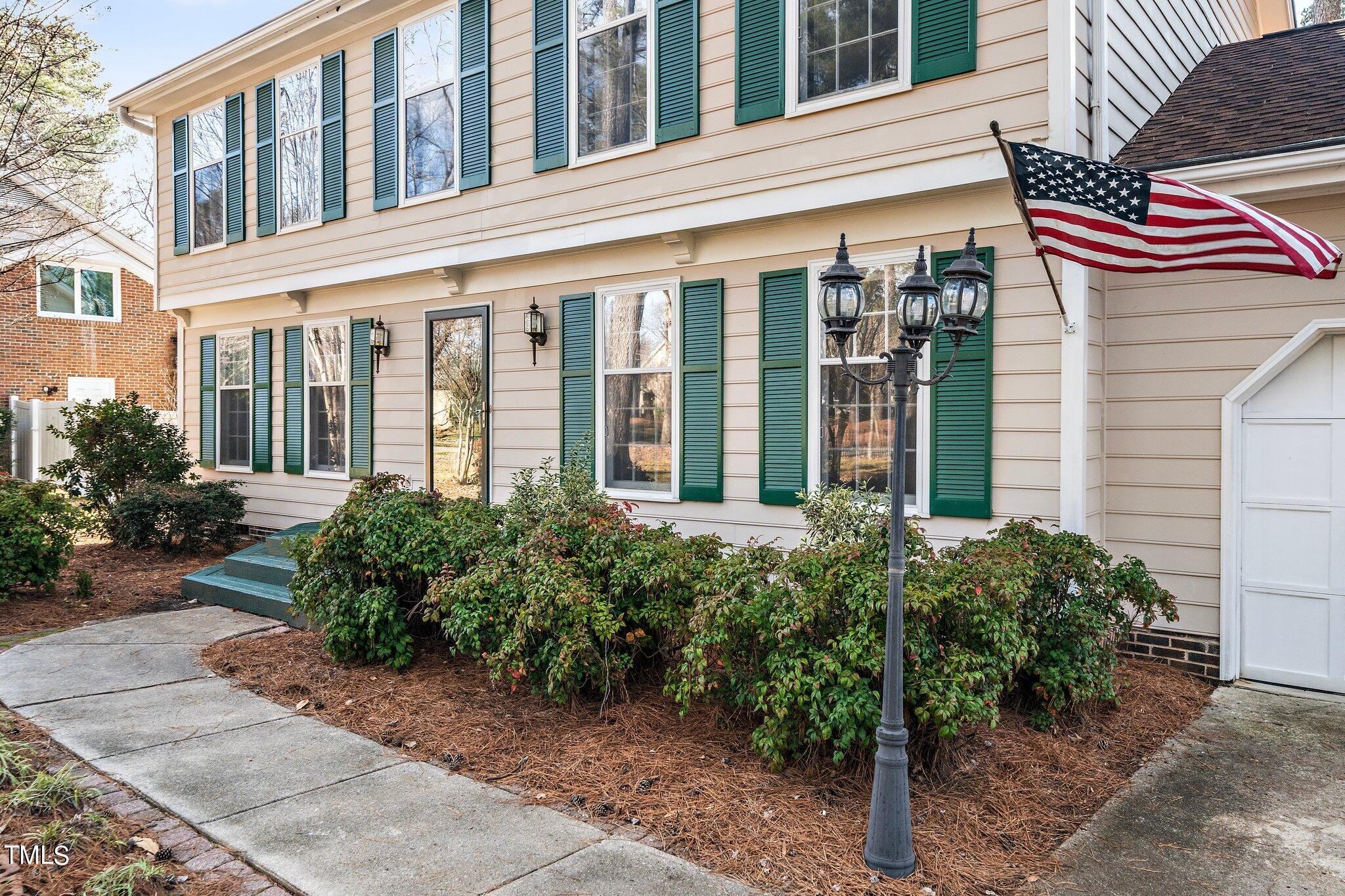 5705 Timber Ridge Drive Raleigh, NC 27609 - Photo 26 of 31 a view of a building with potted plants