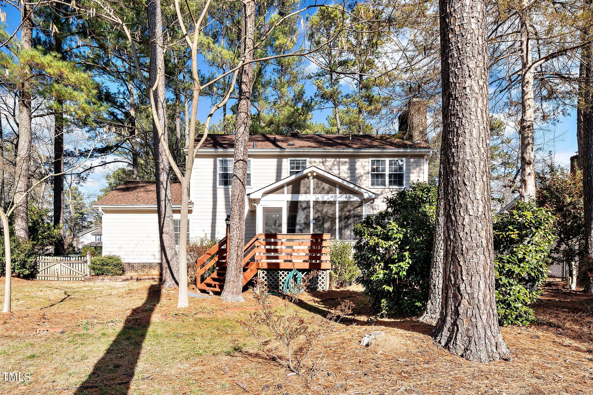 5705 Timber Ridge Drive Raleigh, NC 27609 - Photo 29 of 31 a view of a house with large trees