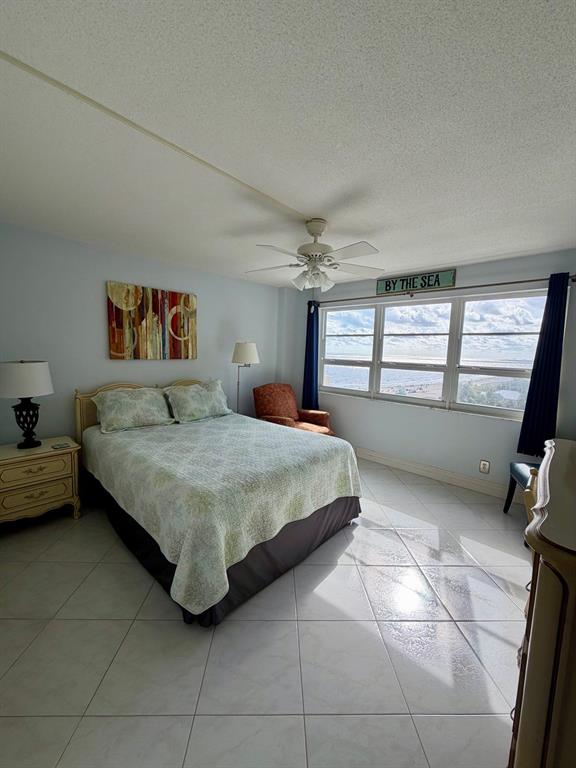 133 North Pompano Beach Boulevard, Unit 911 Pompano Beach, FL 33062 - Photo 11 of 21 a bedroom with a bed and a window