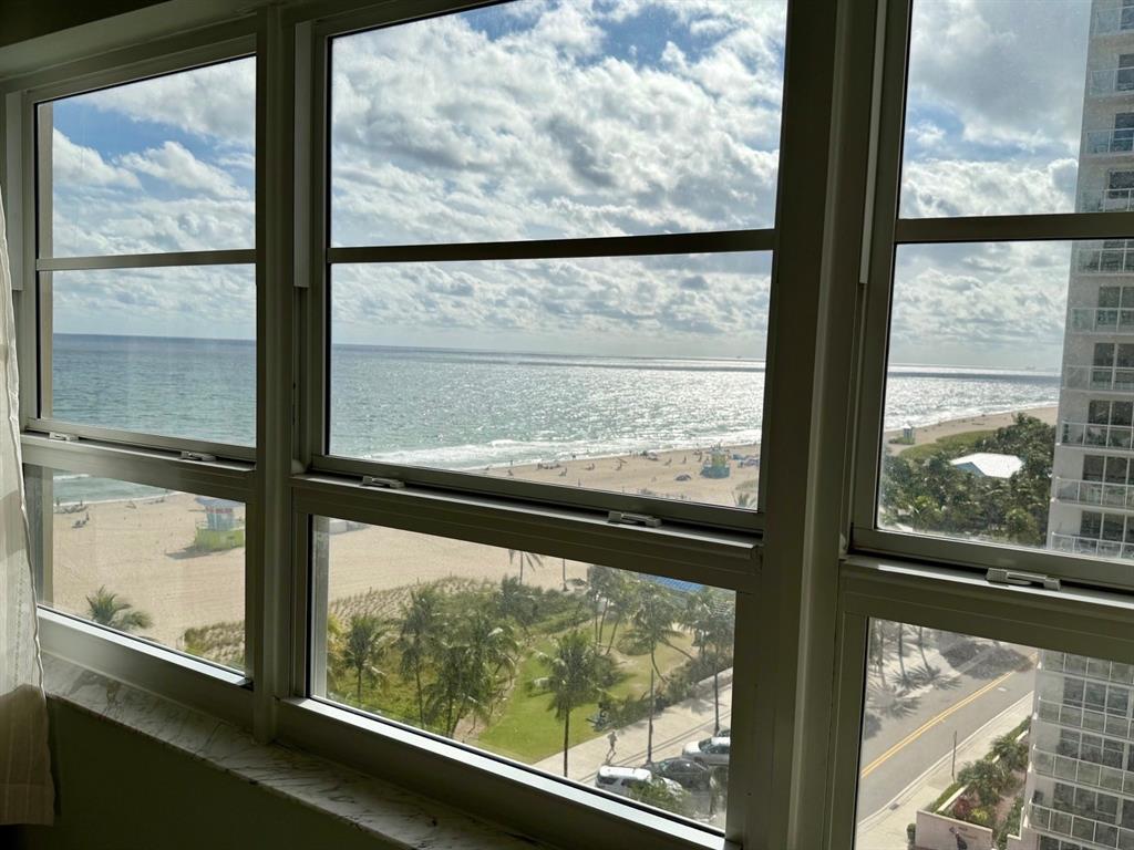 133 North Pompano Beach Boulevard, Unit 911 Pompano Beach, FL 33062 - Photo 13 of 21 a view of a glass door with a from a glass window