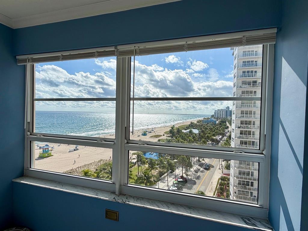 133 North Pompano Beach Boulevard, Unit 911 Pompano Beach, FL 33062 - Photo 7 of 21 a view of a room with wooden floor and a floor to ceiling window