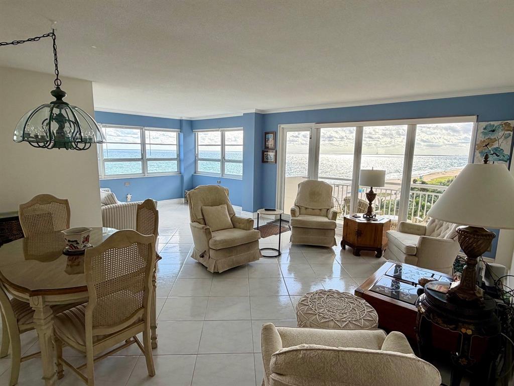 133 North Pompano Beach Boulevard, Unit 911 Pompano Beach, FL 33062 - Photo 8 of 21 a living room with furniture and a large window