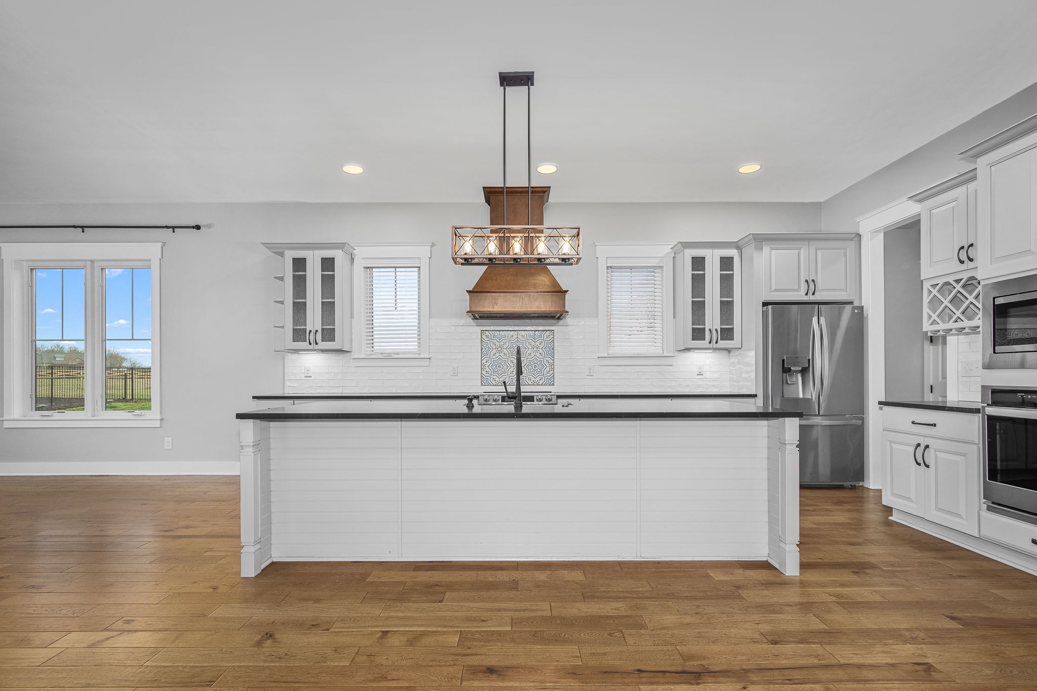 5296 Cross Plains Road White House, TN 37188 - Photo 12 of 87 a kitchen with stainless steel appliances granite countertop a refrigerator a stove and a sink