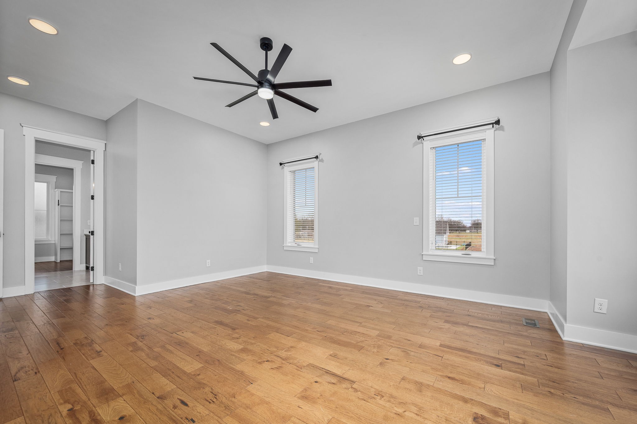 5296 Cross Plains Road White House, TN 37188 - Photo 28 of 87 a view of an empty room with wooden floor and a window