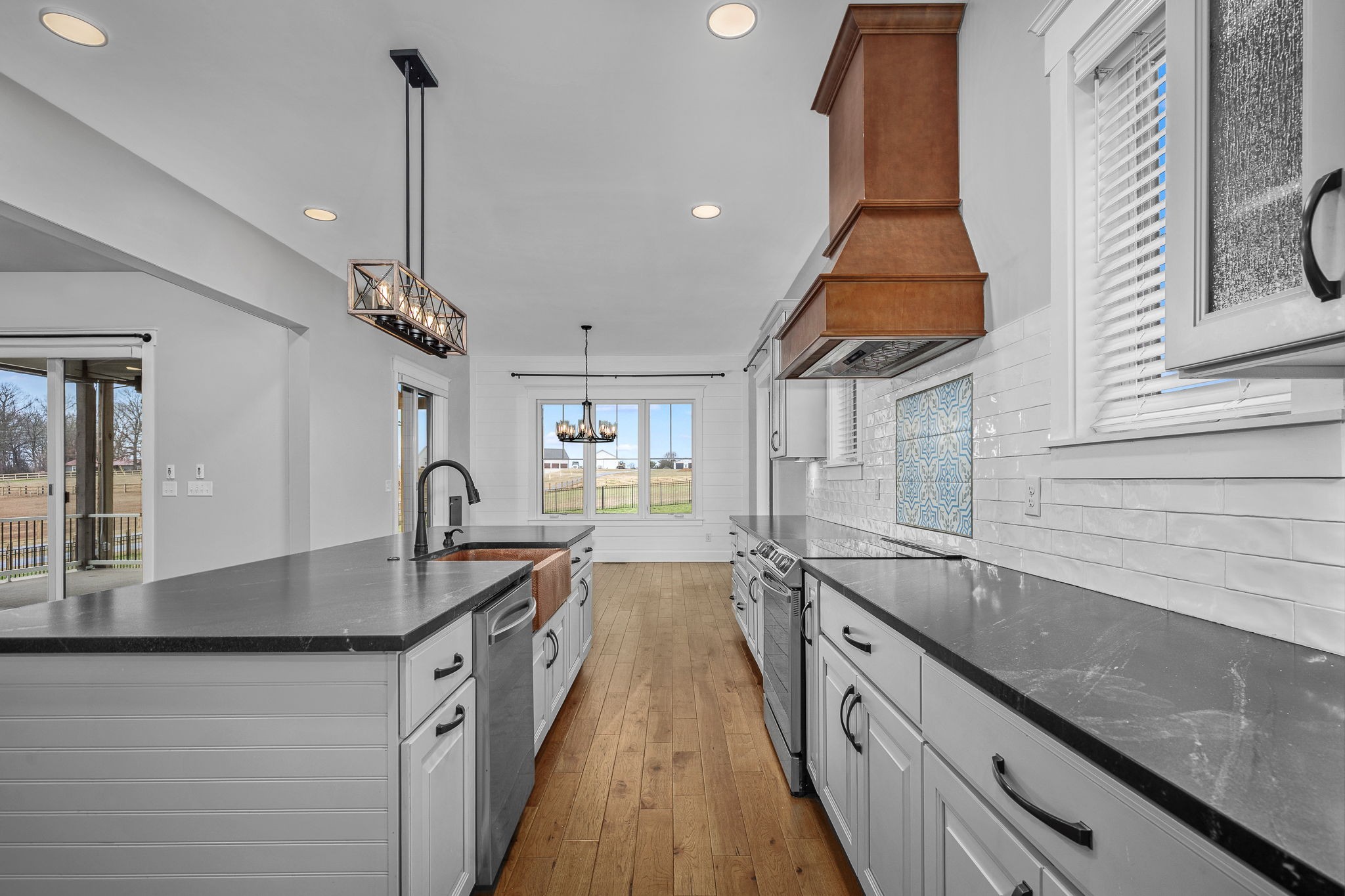 5296 Cross Plains Road White House, TN 37188 - Photo 4 of 87 a kitchen with stainless steel appliances granite countertop sink stove and refrigerator