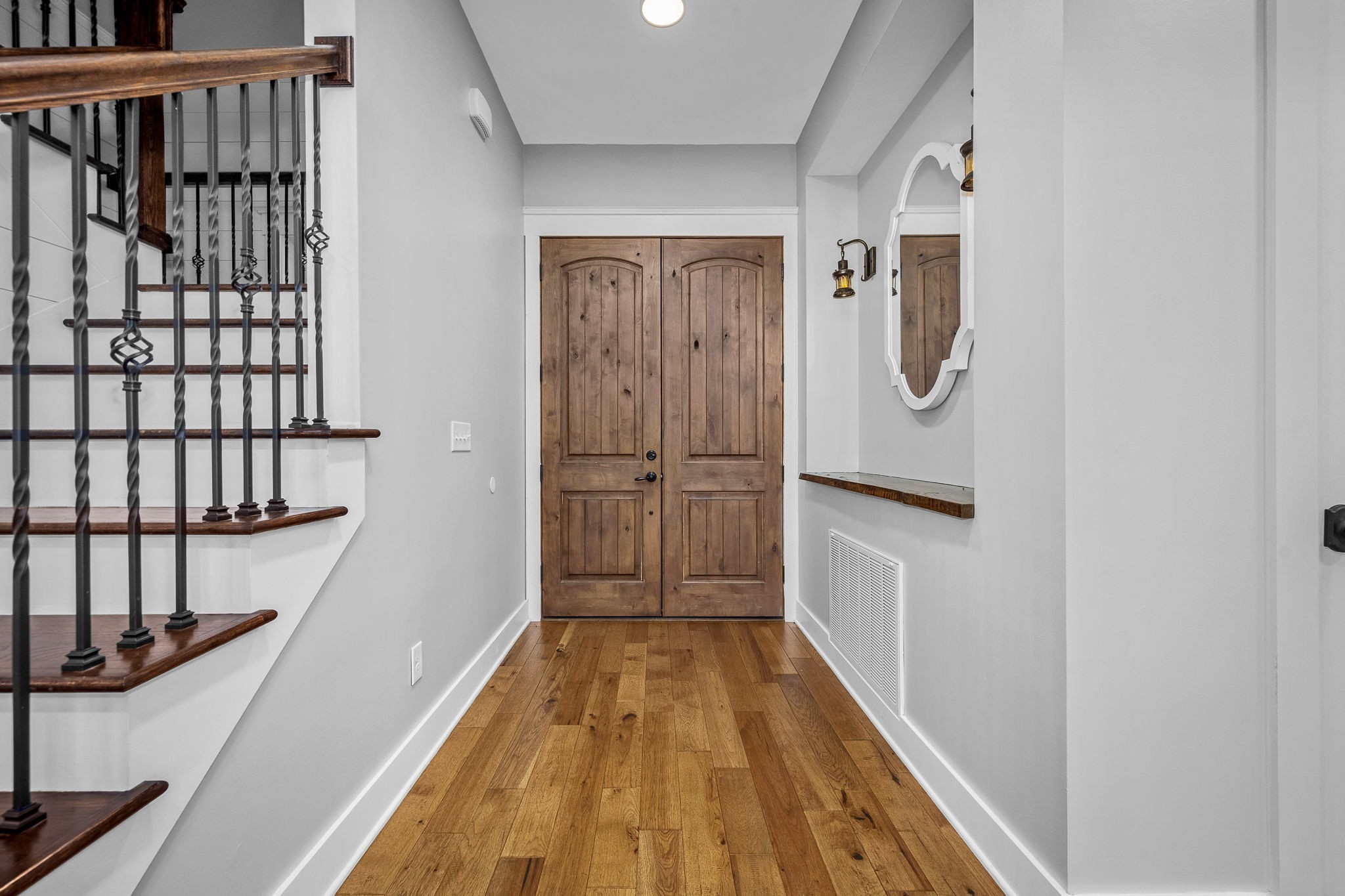5296 Cross Plains Road White House, TN 37188 - Photo 5 of 87 a view of a hallway with wooden floor and staircase
